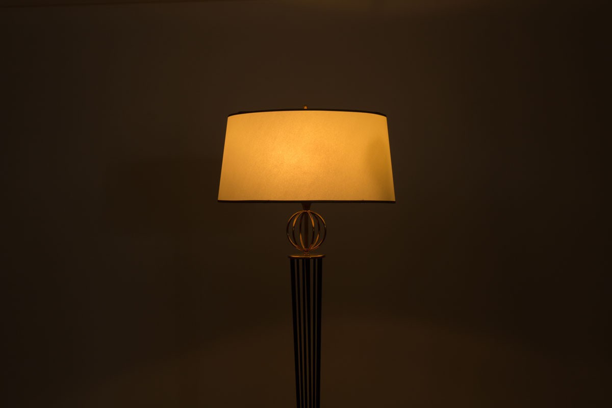 Floor lamp in brass black metal and beige paper lampshade 1950