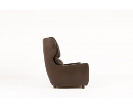 Fauteuil et repose-pieds en cuir marron et pieds bois 1970