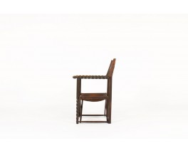 Armchair in dark wood with brown leather 1950