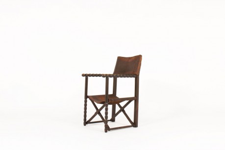 Fauteuil en chêne foncé et cuir marron 1950