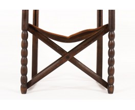 Armchair in dark wood with brown leather 1950