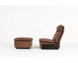 Armchair and footrest in leather edition De Sède 1970