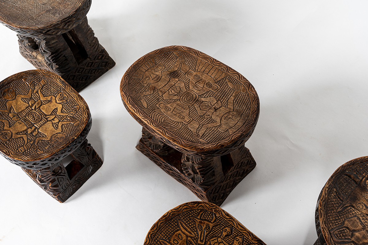 Monoxyl stools in black carved wood African design 1950 set of 5