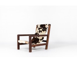 Armchair in mahogany and cowhide seat 1950