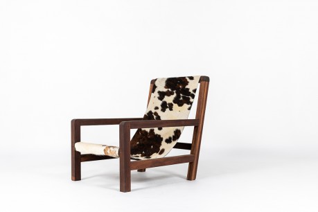 Fauteuil en acajou et assise peau de vache 1950