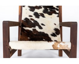 Armchair in mahogany and cowhide seat 1950