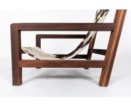 Armchair in mahogany and cowhide seat 1950