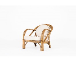 Audoux Minet armchair in rattan and linen cushions 1950