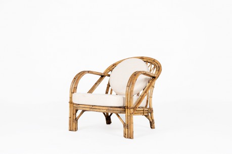 Fauteuil Audoux Minet en rotin et coussin lin 1950