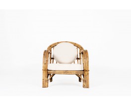 Audoux Minet armchair in rattan and linen cushions 1950