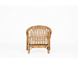 Audoux Minet armchair in rattan and linen cushions 1950