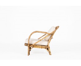 Audoux Minet armchair in rattan and linen cushions 1950