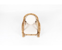 Audoux Minet armchair in rattan and linen cushions 1950