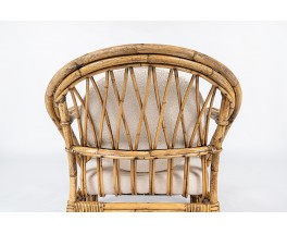 Audoux Minet armchair in rattan and linen cushions 1950