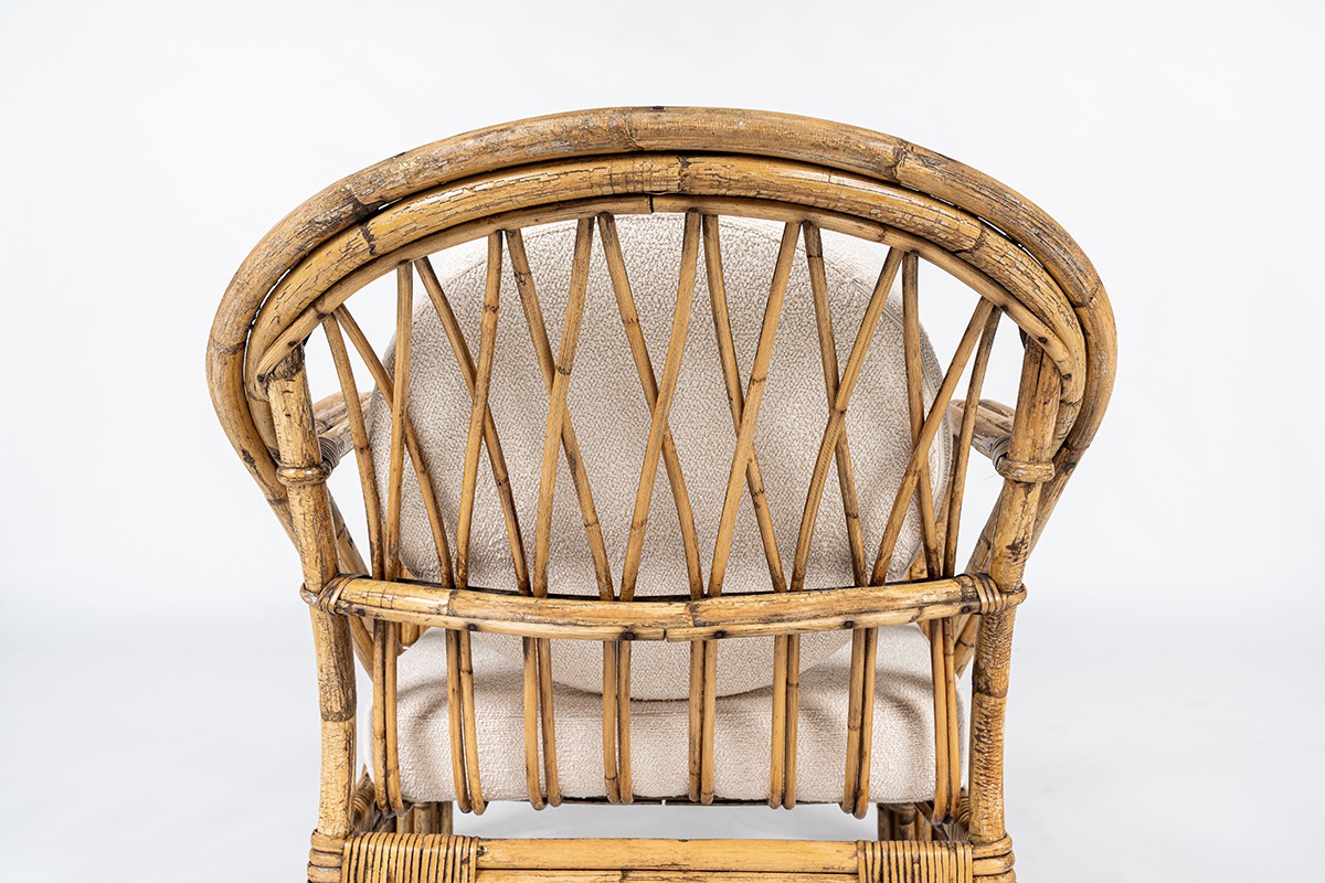 Audoux Minet armchair in rattan and linen cushions 1950