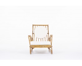 Audoux Minet armchair in rattan with beige terry cushions 1950