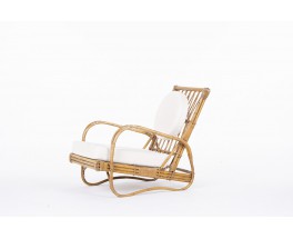 Audoux Minet armchair in rattan with beige terry cushions 1950