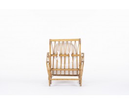 Audoux Minet armchair in rattan with beige terry cushions 1950