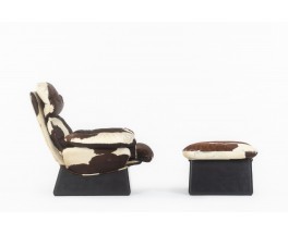 Armchair and footstool in cowhide 1970