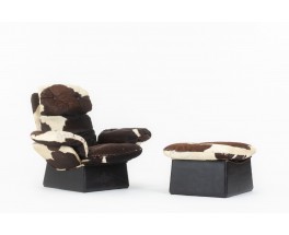 Armchair and footstool in cowhide 1970