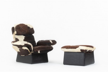 Armchair and footstool in cowhide 1970