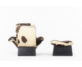 Armchair and footstool in cowhide 1970