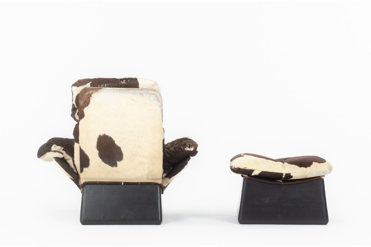 Armchair and footstool in cowhide 1970