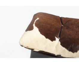 Fauteuil et repose-pieds en peau de vache 1970