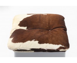 Armchair and footstool in cowhide 1970